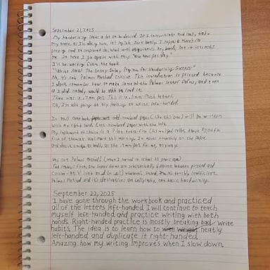 A writer working on a lengthy passage in a notebook.