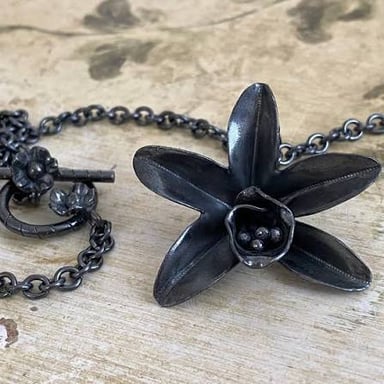 A finely crafted piece of jewelry showing exceptional detail.