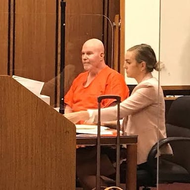 A person is accused during a courtroom proceeding.