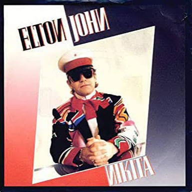 Elton John appears in a scene from the music video for “Nikita.”