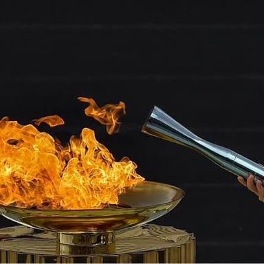 Olympic torches carrying the flame during a relay.