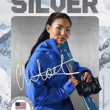 Chloe Kim performing a snowboarding maneuver in a halfpipe