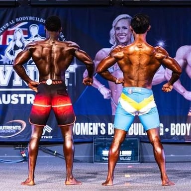 A bodybuilder displaying a well-developed muscular physique.