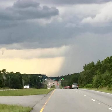 Rain falling onto a street.