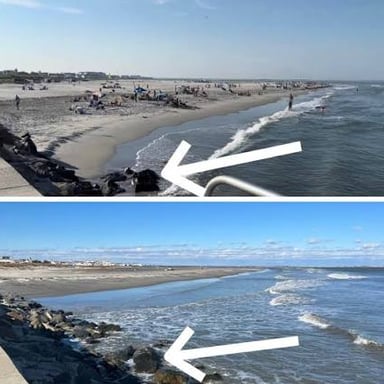 Seawater recedes from the shore as the tide goes out.