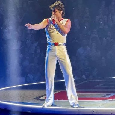 Singer Benson Boone performing on stage