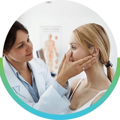 An ear, nose, and throat doctor examines a patient.