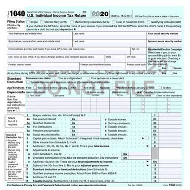 A person preparing documents for a federal income tax filing