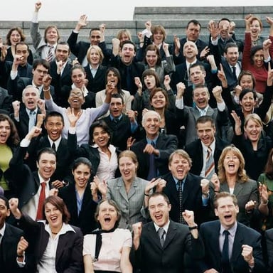 An audience reacts without much enthusiasm to a presentation.