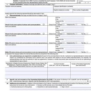 An accountant reviewing financial and tax documents.