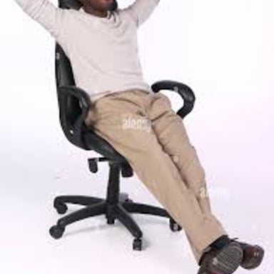 A person resting comfortably in a chair.