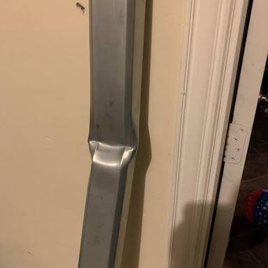 A stiff metal bar shown resisting bending.