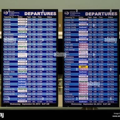 An airport departures board displaying scheduled flight information.