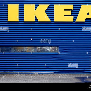 The blue-and-yellow IKEA name displayed on a store sign.