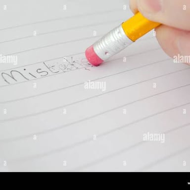 A written mistake being corrected with an eraser.