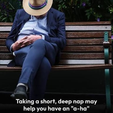 A person sitting up and alert after waking from a nap.