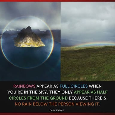 A rainbow appears as a bright curved arc against the sky.