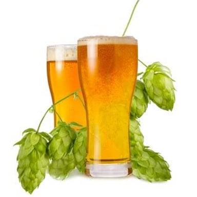 A glass of India pale ale beside hop cones, the flowers used to add flavor and bitterness to beer.