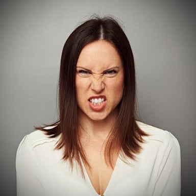 An angry person with a visibly frustrated expression.
