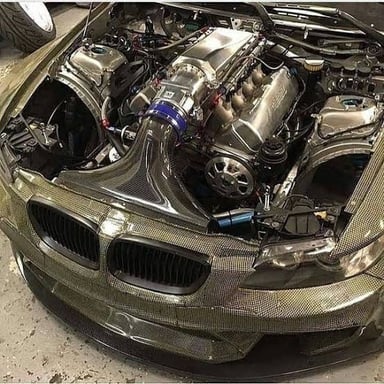 A visible V8 engine with its cylinder banks and components