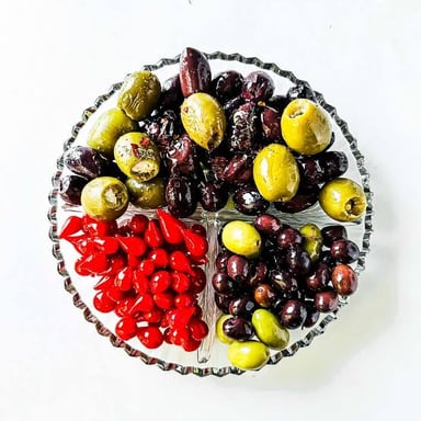 Green and black olives arranged on a relish tray
