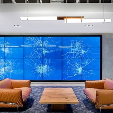 Computer screens and hardware in a technology workplace.