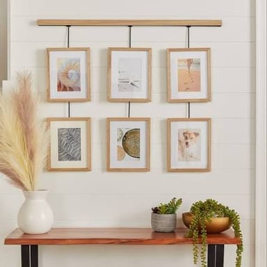 A framed artwork hung on a wall, illustrating a common kind of wall “flower.”