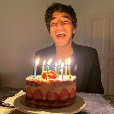 A birthday cake with candles marking a person's age.