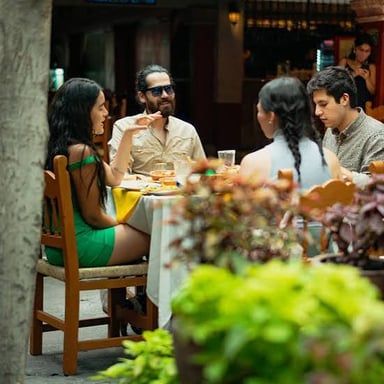 One person offers to cover the cost of a meal for a companion.
