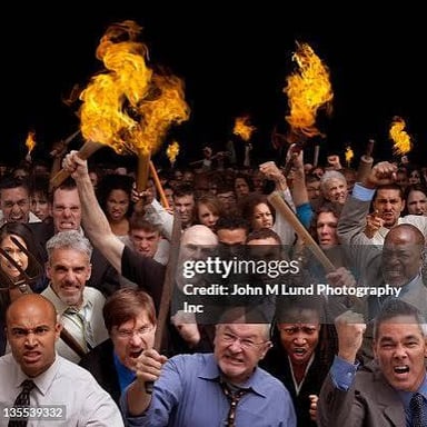 A person provoking a visibly agitated crowd