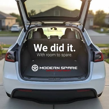 A spare tire stored in the trunk of a car.