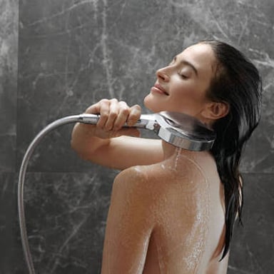 A person taking a shower after a workout.