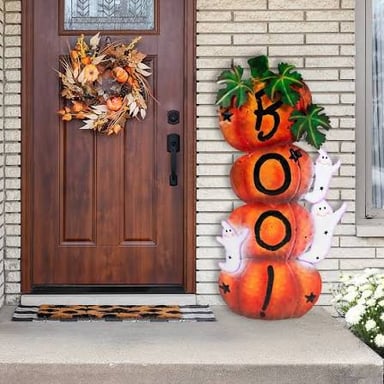 Orange pumpkins and black decorations arranged for Halloween