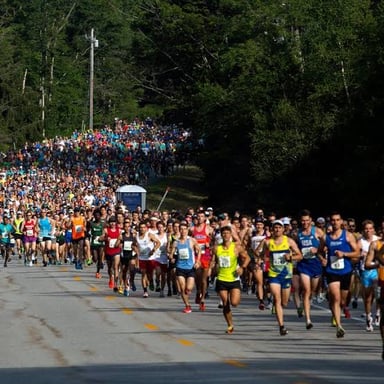 Participants running together in a 10K road race.