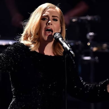 English singer Adele performing onstage.