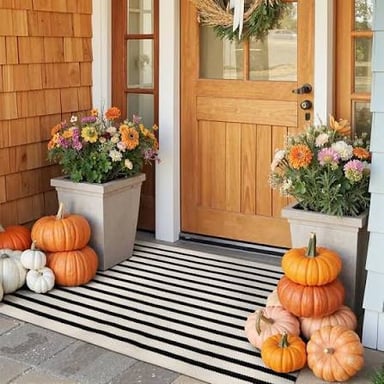 A welcome mat placed in front of a home’s doorway.