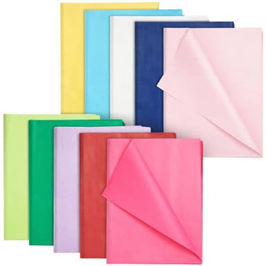 Lightweight colored tissue paper arranged for wrapping a gift.