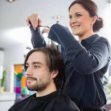 A stylist cutting a client's hair.