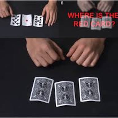 A magician displaying cards during a trick
