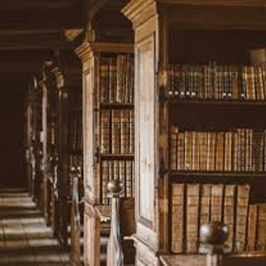 An old library with bookshelves, reading tables, and a scholarly, moody atmosphere.