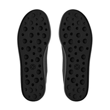 The rubber sole of a shoe meeting the pavement.
