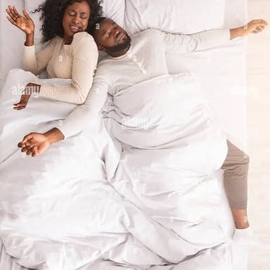 A person sprawled across most of a bed
