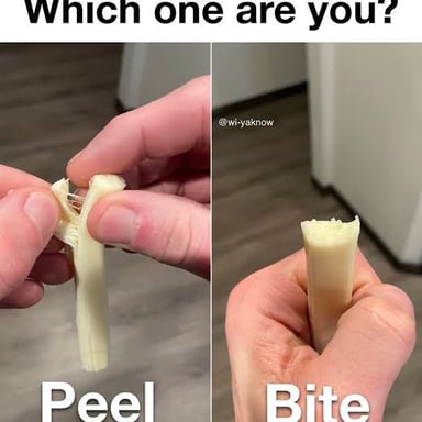 A stick of string cheese peeled into several long strands.