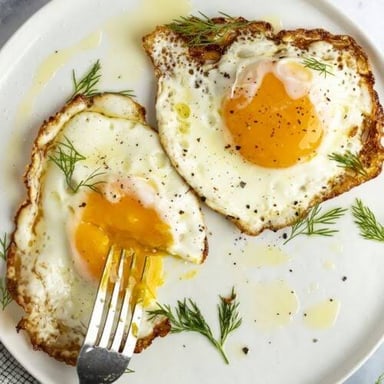 A sunny-side-up egg with a visibly liquid yolk