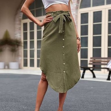 A person wearing a skirt that reaches approximately mid-calf.