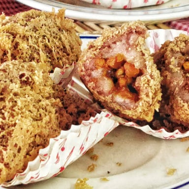 A fried taro dumpling, a dim sum dish with a flaky exterior.
