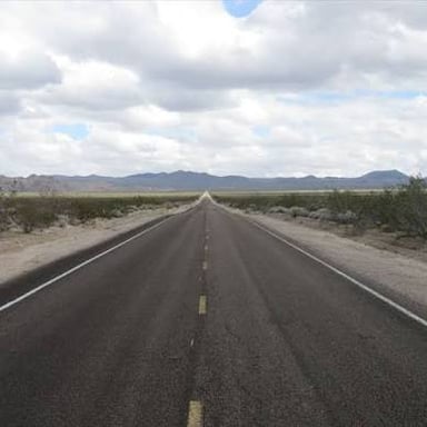 A road stretching ahead, a visual metaphor for something happening down the line.