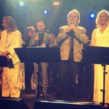 The four members of Swedish pop group ABBA performing together.