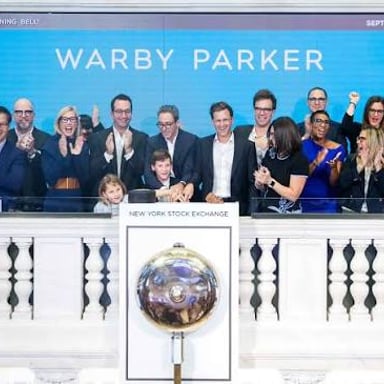 Company representatives celebrating a stock-market initial public offering.