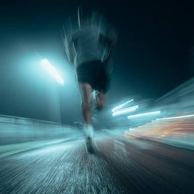 A runner captured with motion blur to suggest high speed.